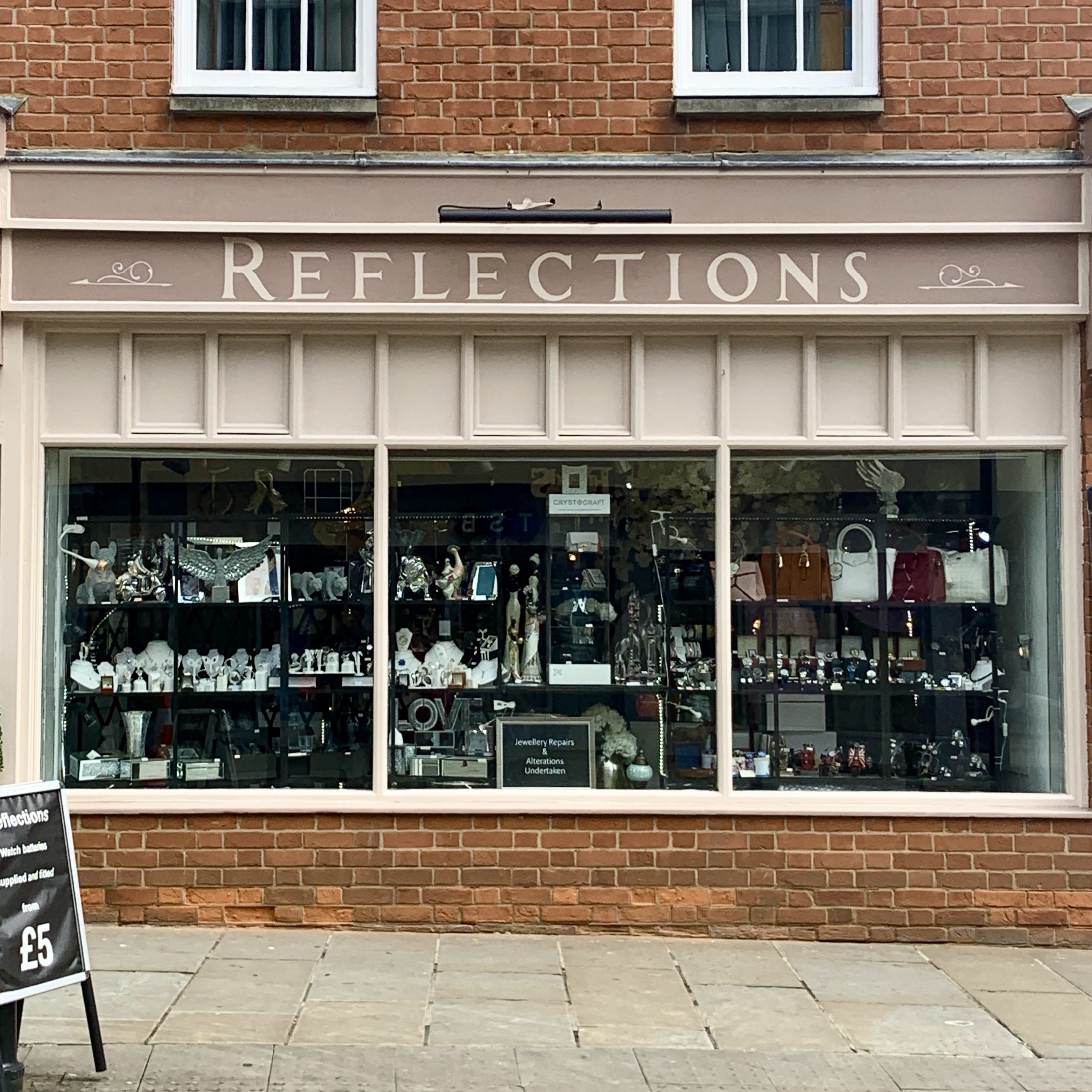 REFLECTIONS hand painted shop fascia in Roman style lettters