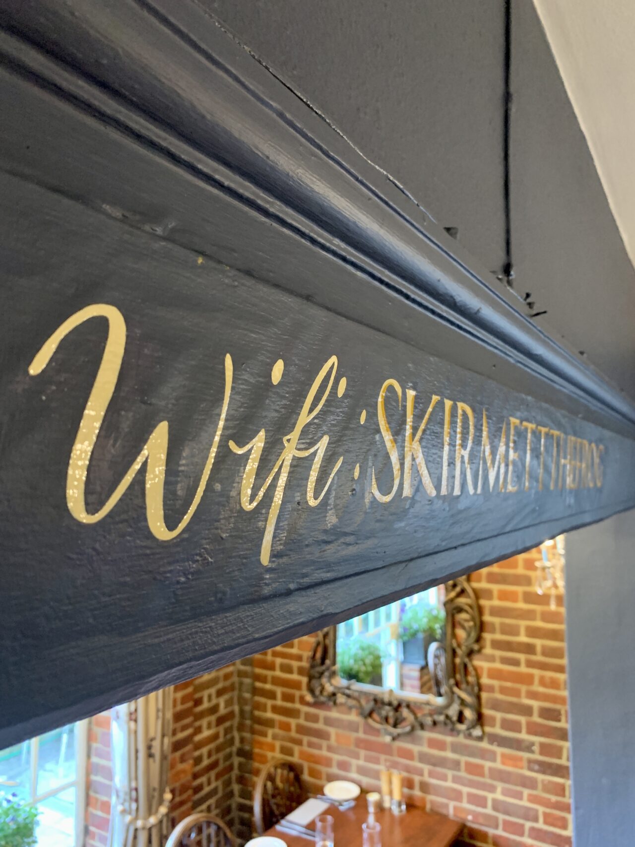 Traditionally hand-painted interior signwork at The Frog in Skirmett