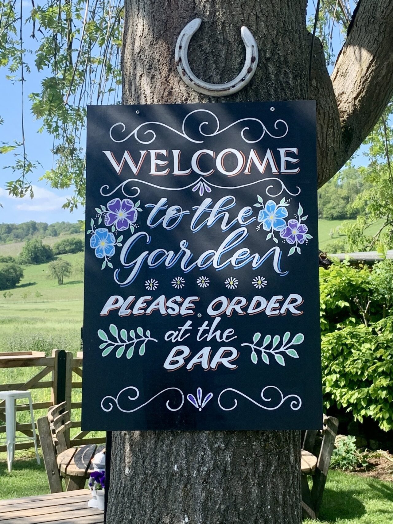 Hand-lettered hand-drawn 'WELCOME to the GARDEN' blackboard sign  at The Frog Inn, Skirmett, Henley-on-Thames