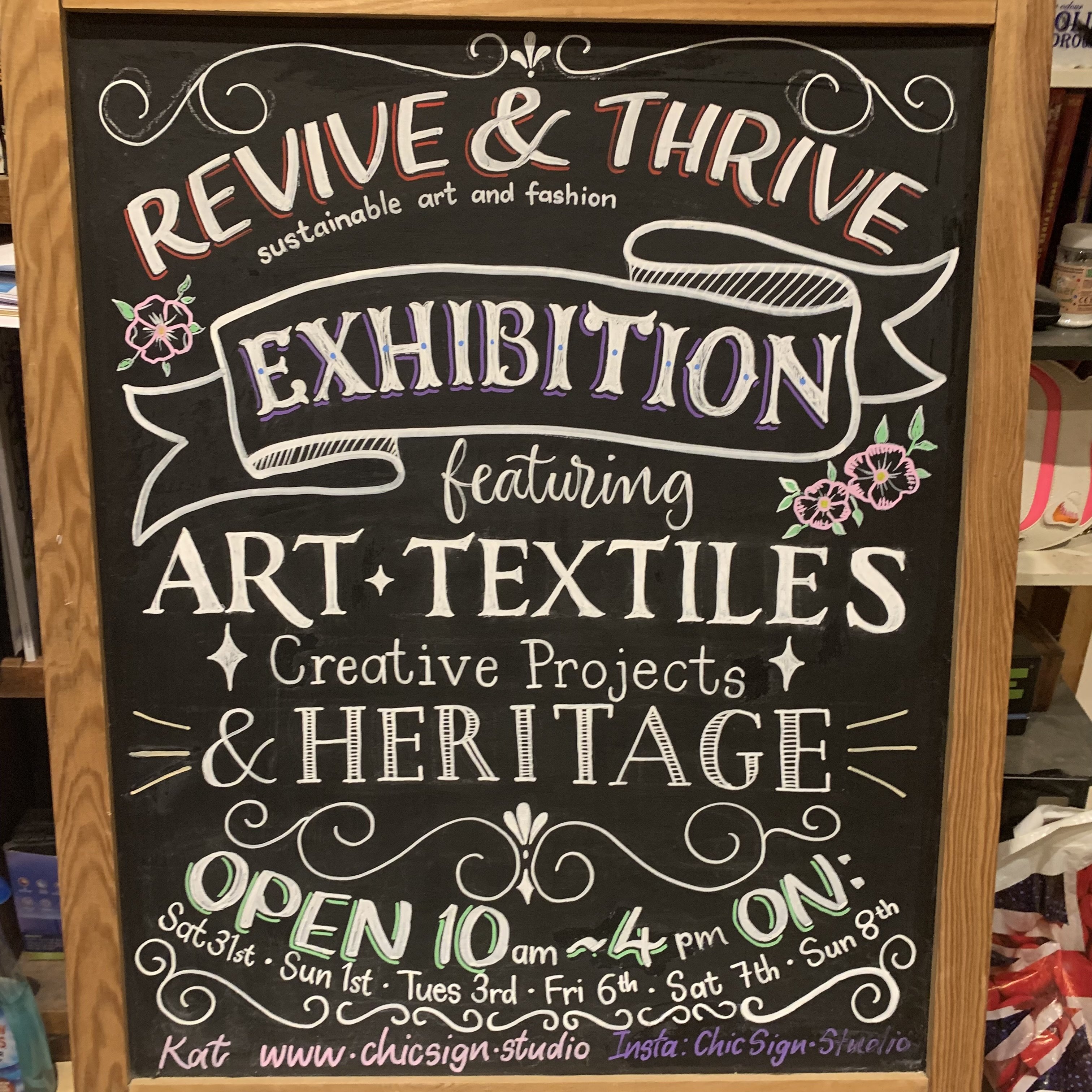 Blackboard handlettered a-board advertising the Revive & Thrive exhibition. Posca pens on a black board